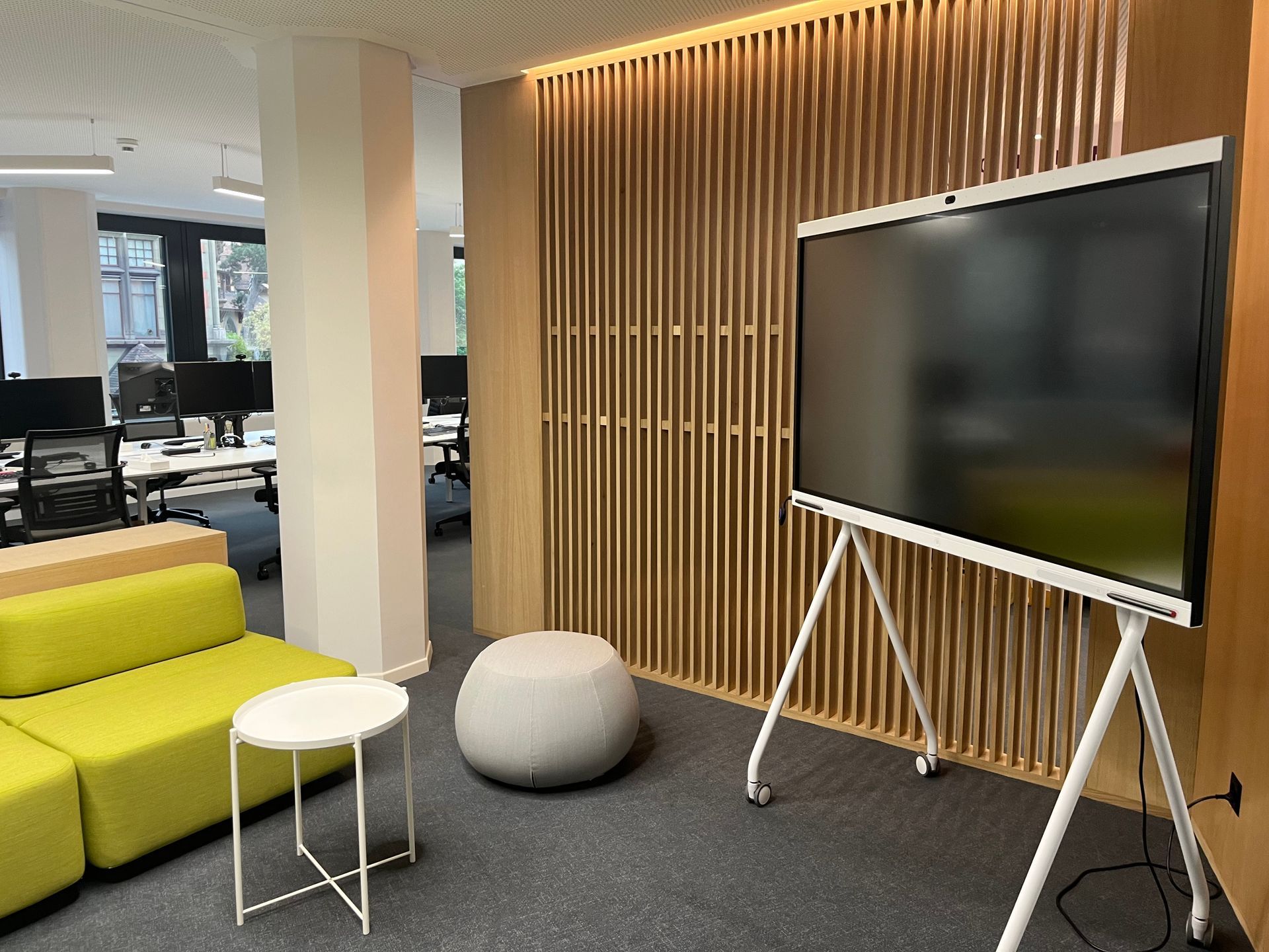 A living room with a couch , table , and television.