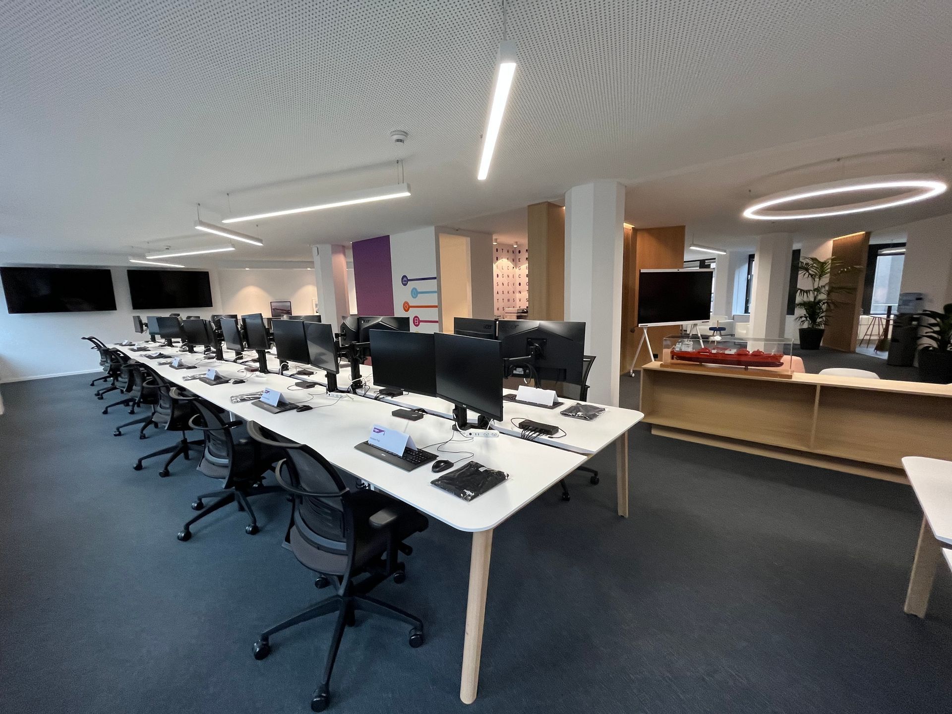 A large office with a lot of desks and chairs