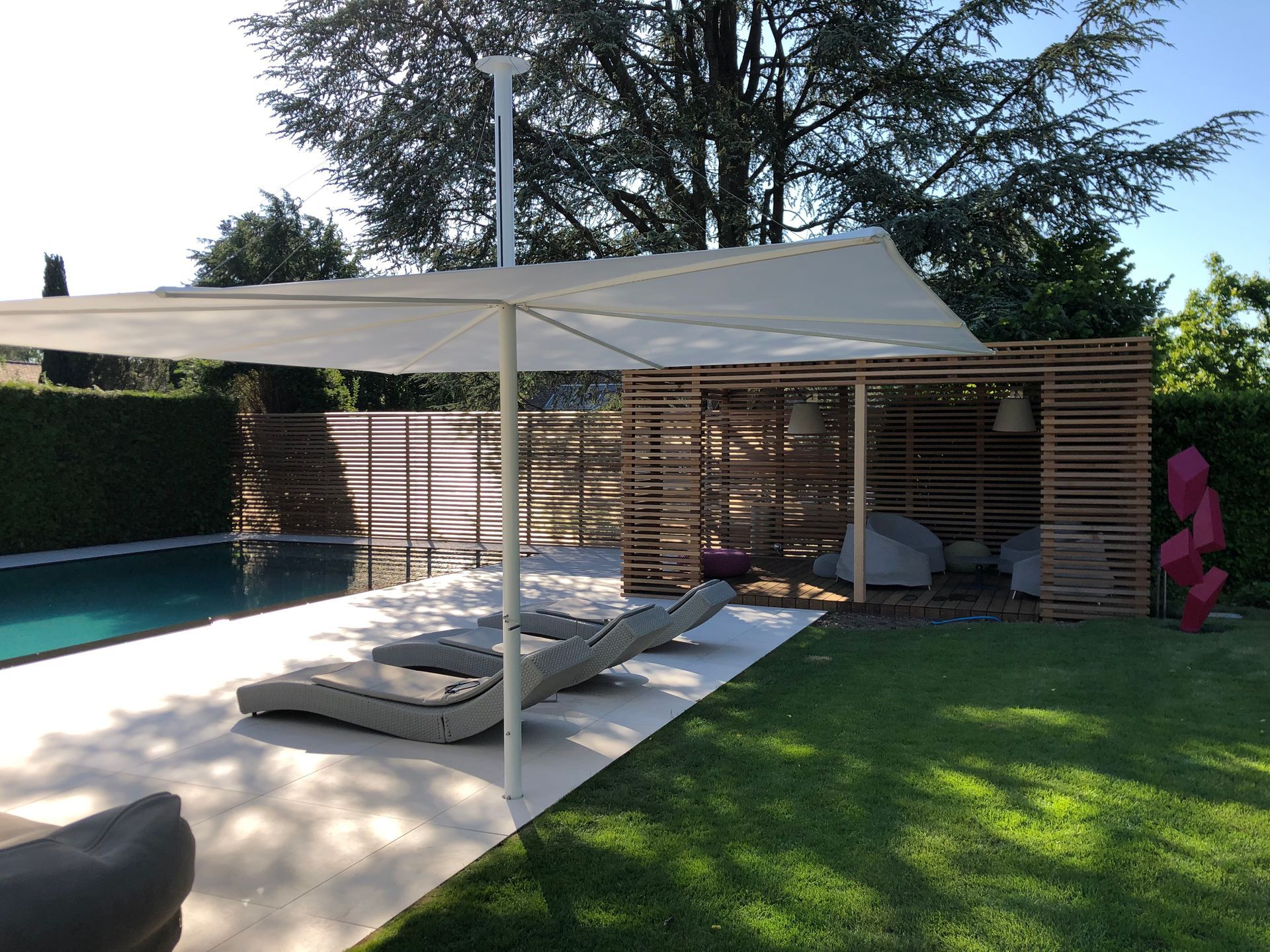 A swimming pool with a white canopy over it