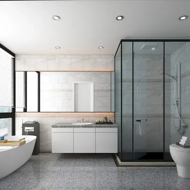 Baño moderno con bañera, ducha, inodoro y tocador. Tonos grises y blancos.