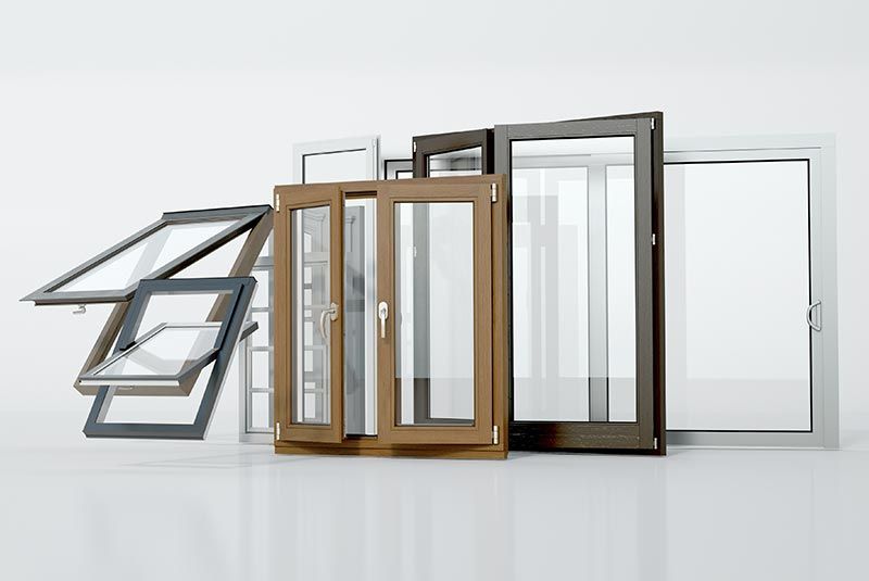Se muestran ventanas surtidas de varios colores, incluidos blanco, marrón y negro, sobre un fondo blanco.