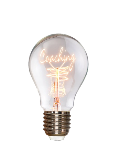 Ampoule transparente avec l'inscription lumineuse Coaching à l'intérieur.