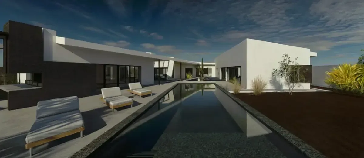 Casa blanca moderna con una pared de acento oscuro, una piscina larga y sillones bajo un cielo azul.