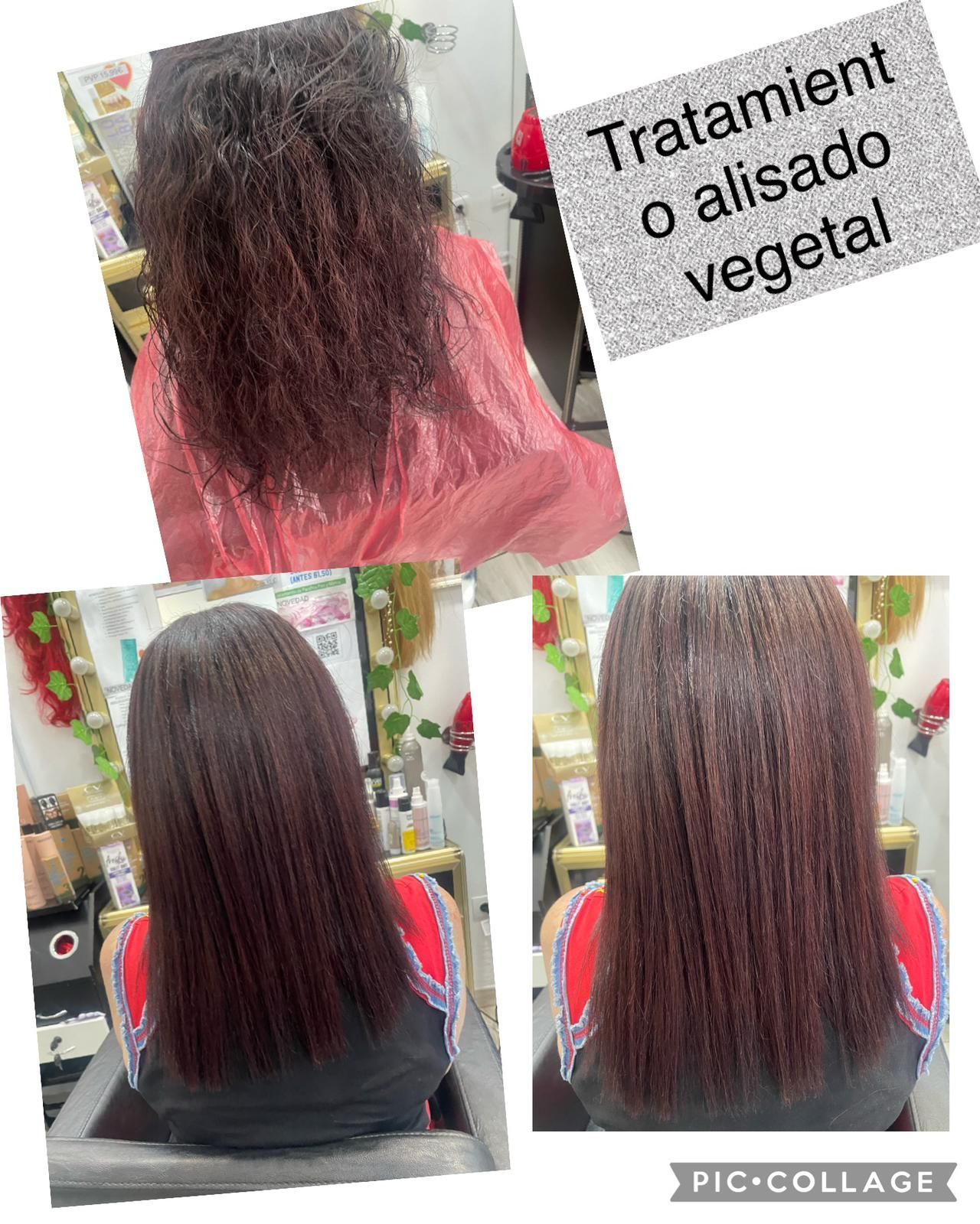 Una mujer se está alisando el cabello en un salón.