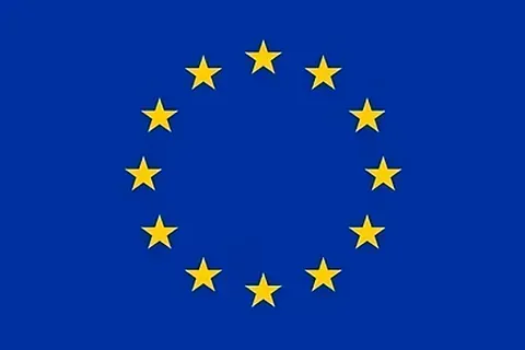 Una bandera azul con estrellas amarillas en un círculo