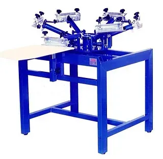 Una mesa azul con una máquina encima.