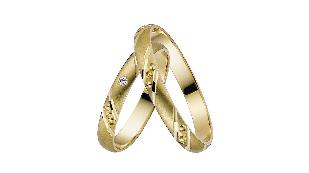 Gelbgoldene Trauringe mit abwechselndem Muster