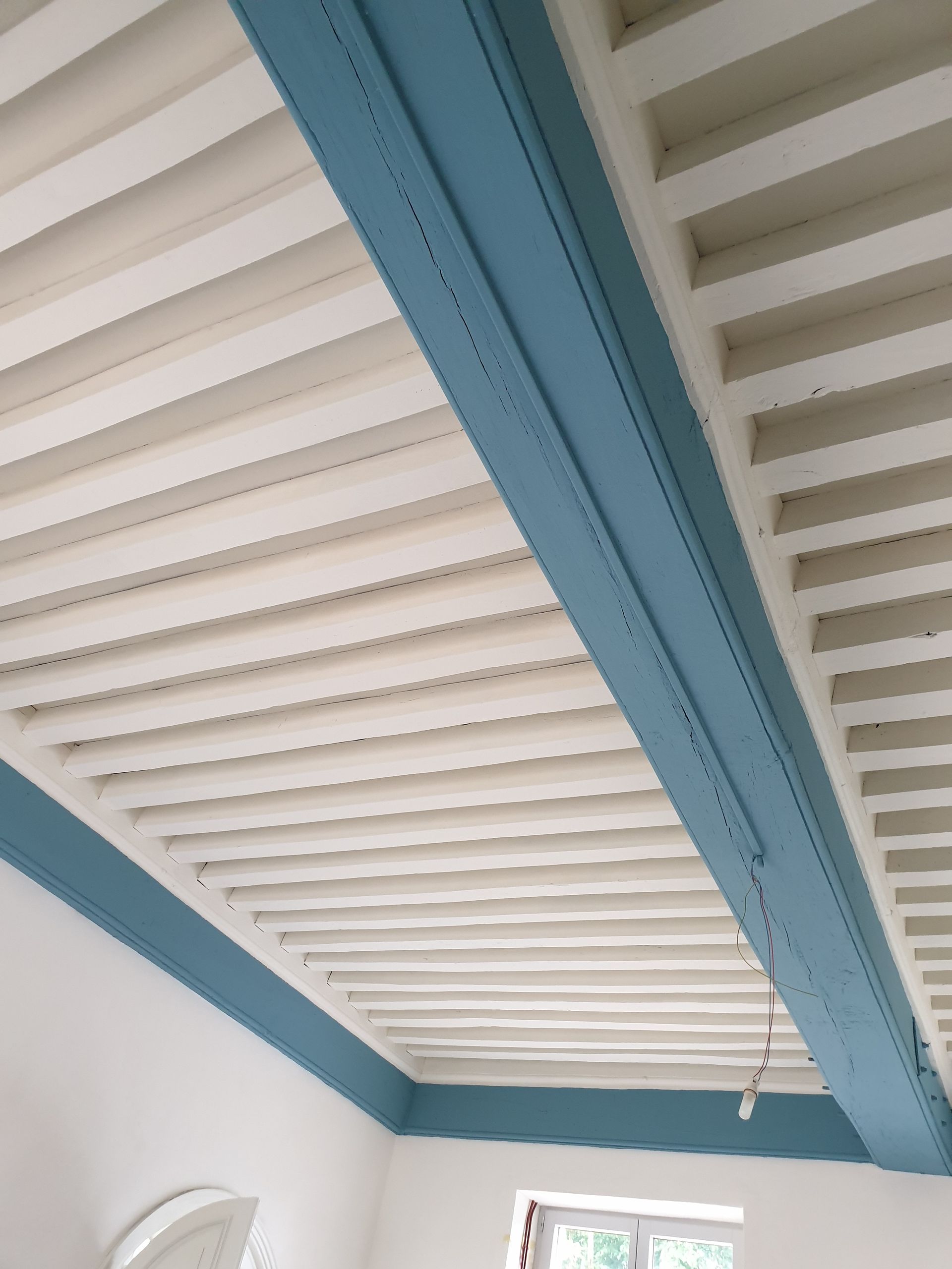 Peinture sur poutres en bois