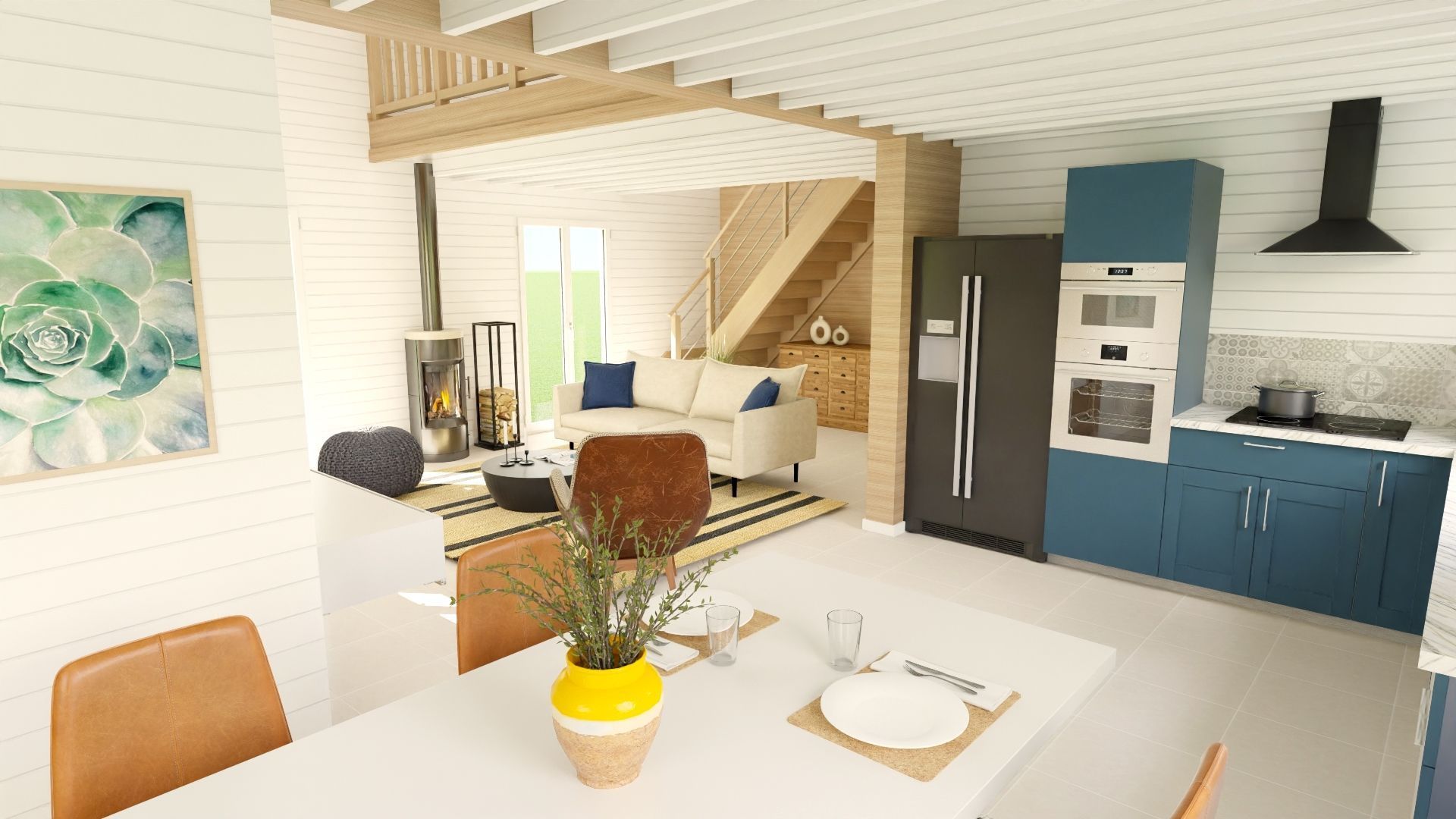Cuisine-salle à manger moderne et lumineuse avec placards bleus, escalier blanc et petite table ornée de fleurs.