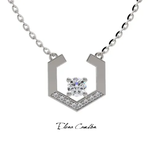 Collar geométrico de oro con una piedra negra sobre fondo blanco.