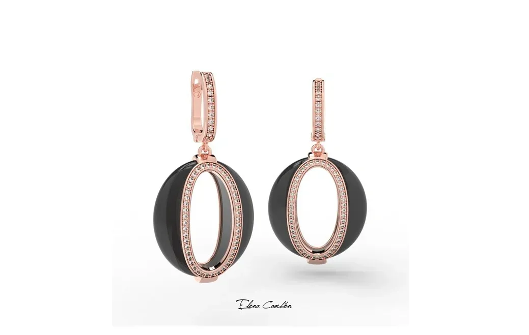 Pendientes colgantes ovalados de oro rosa y negro sobre fondo blanco.