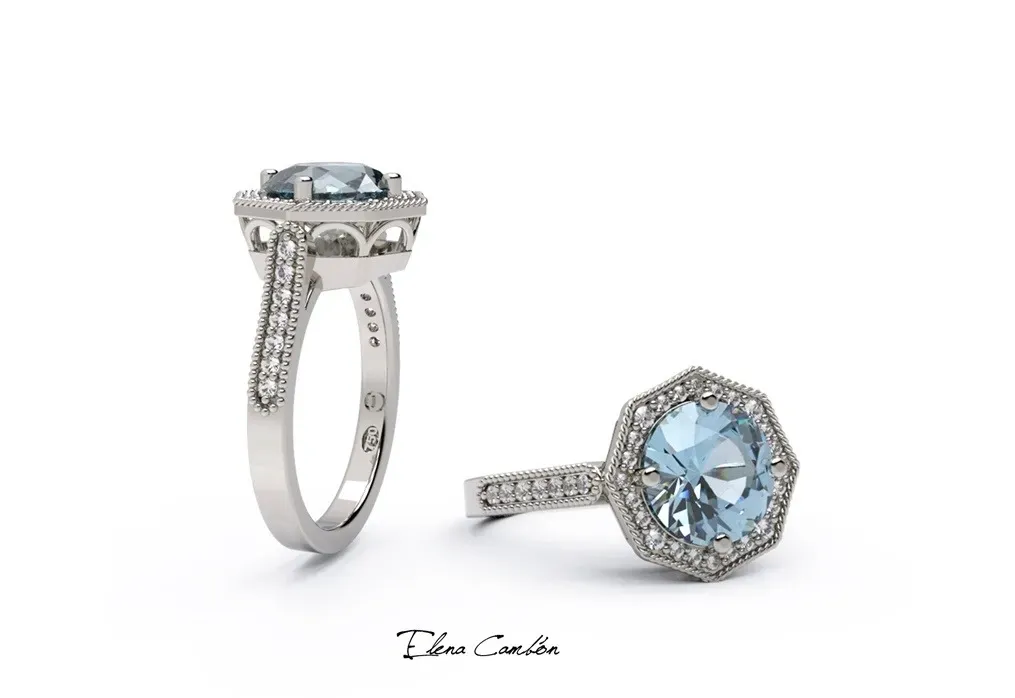 Dos anillos de plata con diamantes sobre un fondo blanco, uno en posición vertical y el otro tumbado.