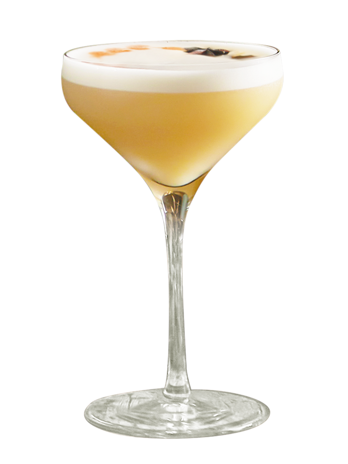 Cocktail jaune servi dans un verre à pied, surmonté d'une mousse onctueuse et garni d'épices.