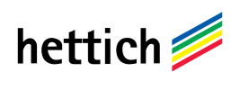 Logotipo de Hettich con texto negro y franjas diagonales multicolores en azul, verde, amarillo, rojo y rosa.