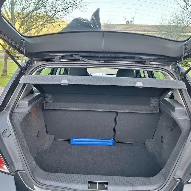 The back of a car with the trunk open