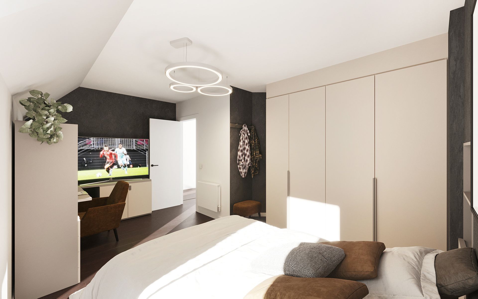 Petite chambre mansardée avec une TV