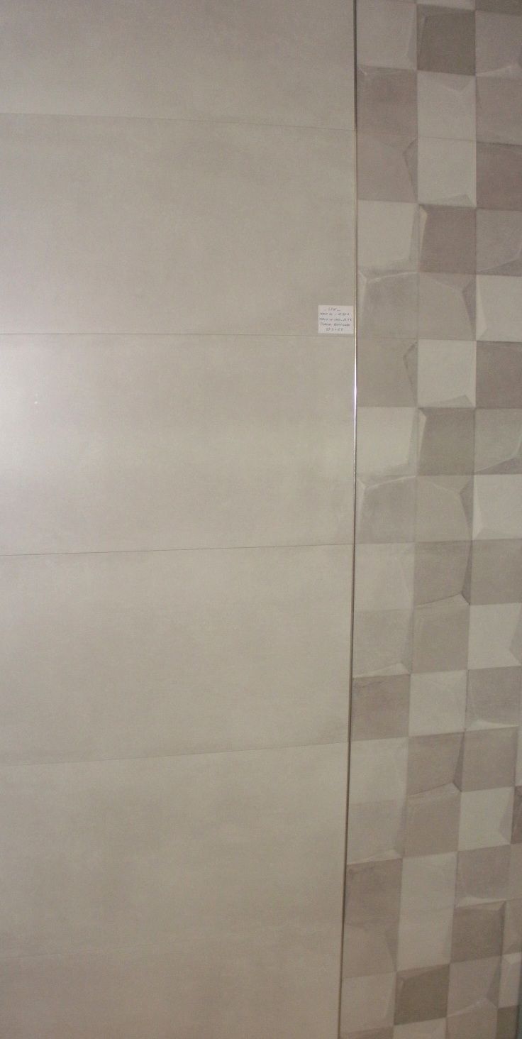 Un primer plano de una pared con azulejos.