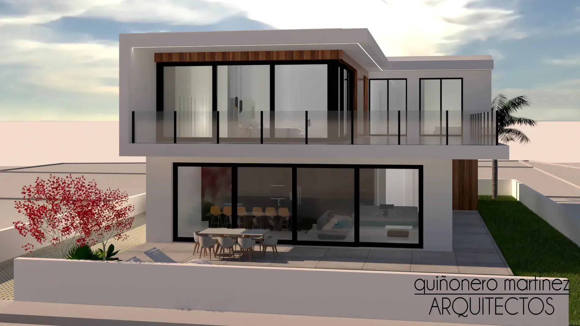 Exterior de una casa moderna de dos plantas con balcones de cristal, grandes ventanales y diseño minimalista en tonos grises.