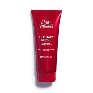 Una botella roja de acondicionador Wella Ultimate Repair