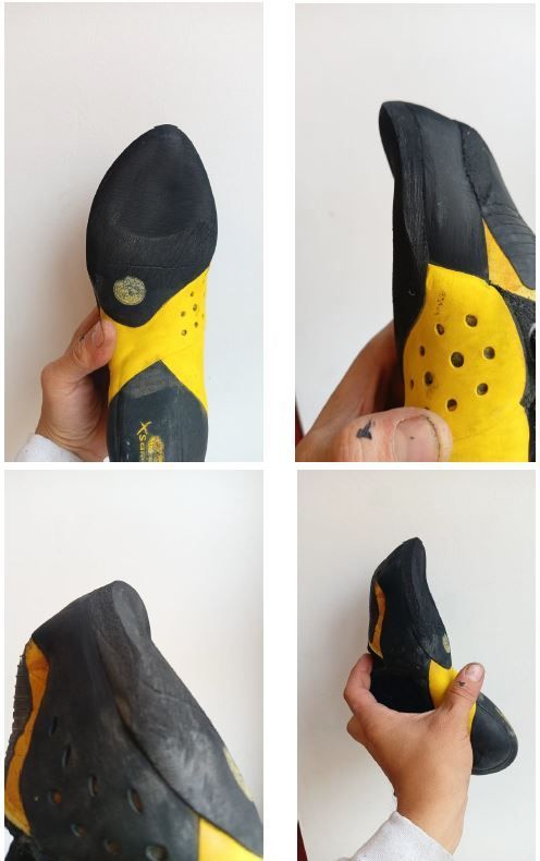 Una persona sostiene un par de zapatos de escalada amarillos y negros.