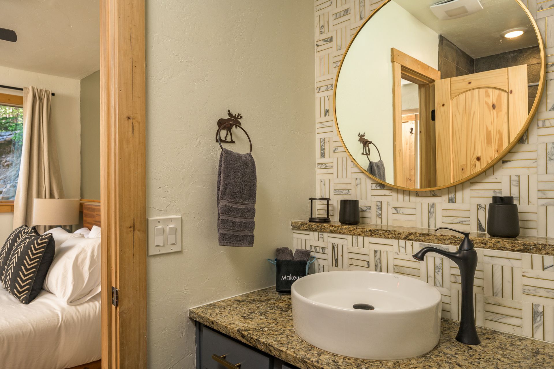 Bathroom sink with round mirror