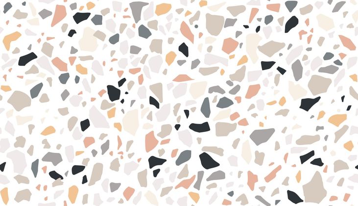 Surface texturée beige clair mouchetée de petites taches grises et beiges