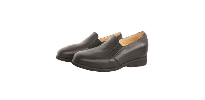 Chaussures habillées noires à enfiler avec doublure beige, présentées côte à côte sur fond blanc