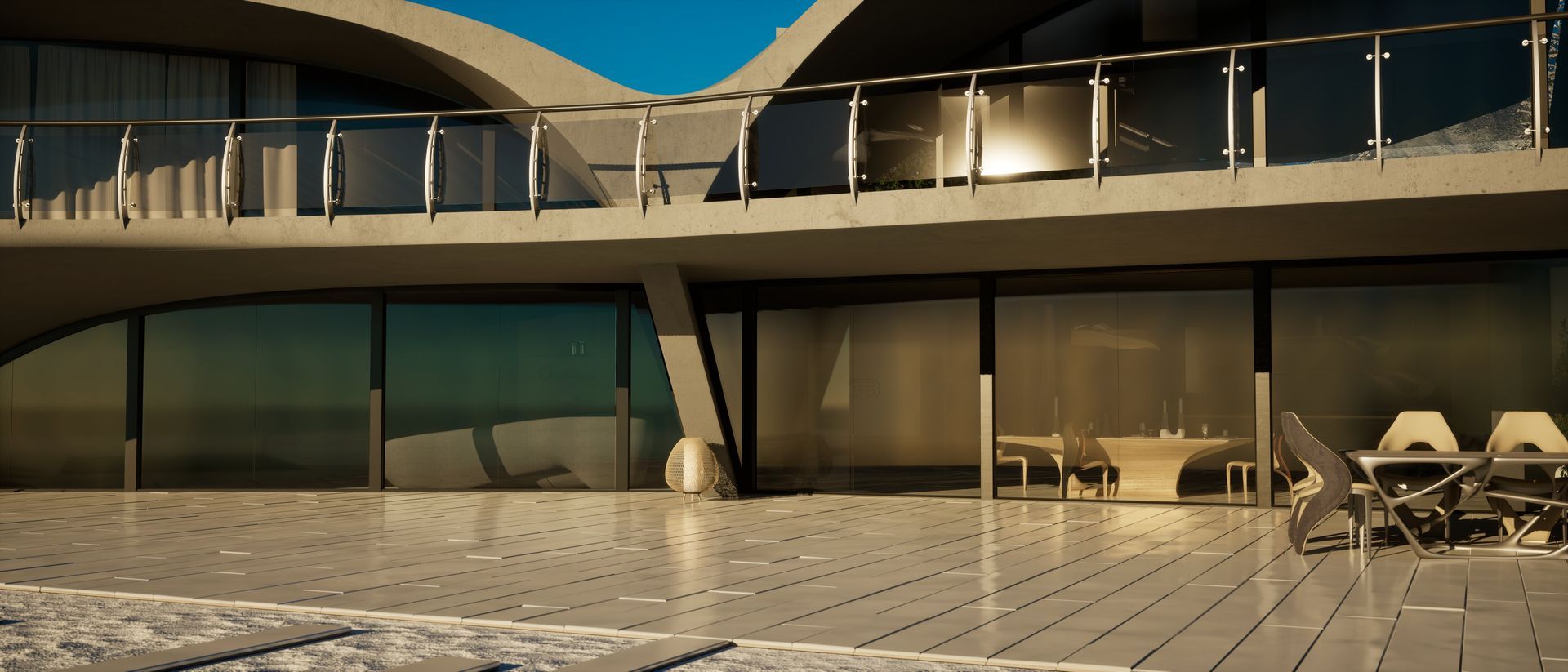 Una casa grande con balcón y mesa y sillas.