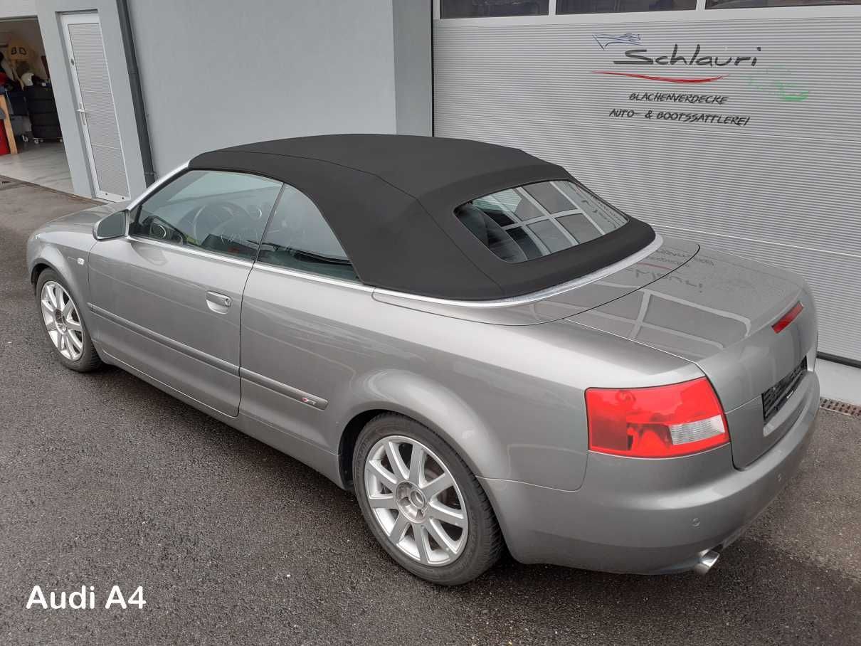 Silberner Audi A4 Cabrio mit schwarzem Stoffverdeck