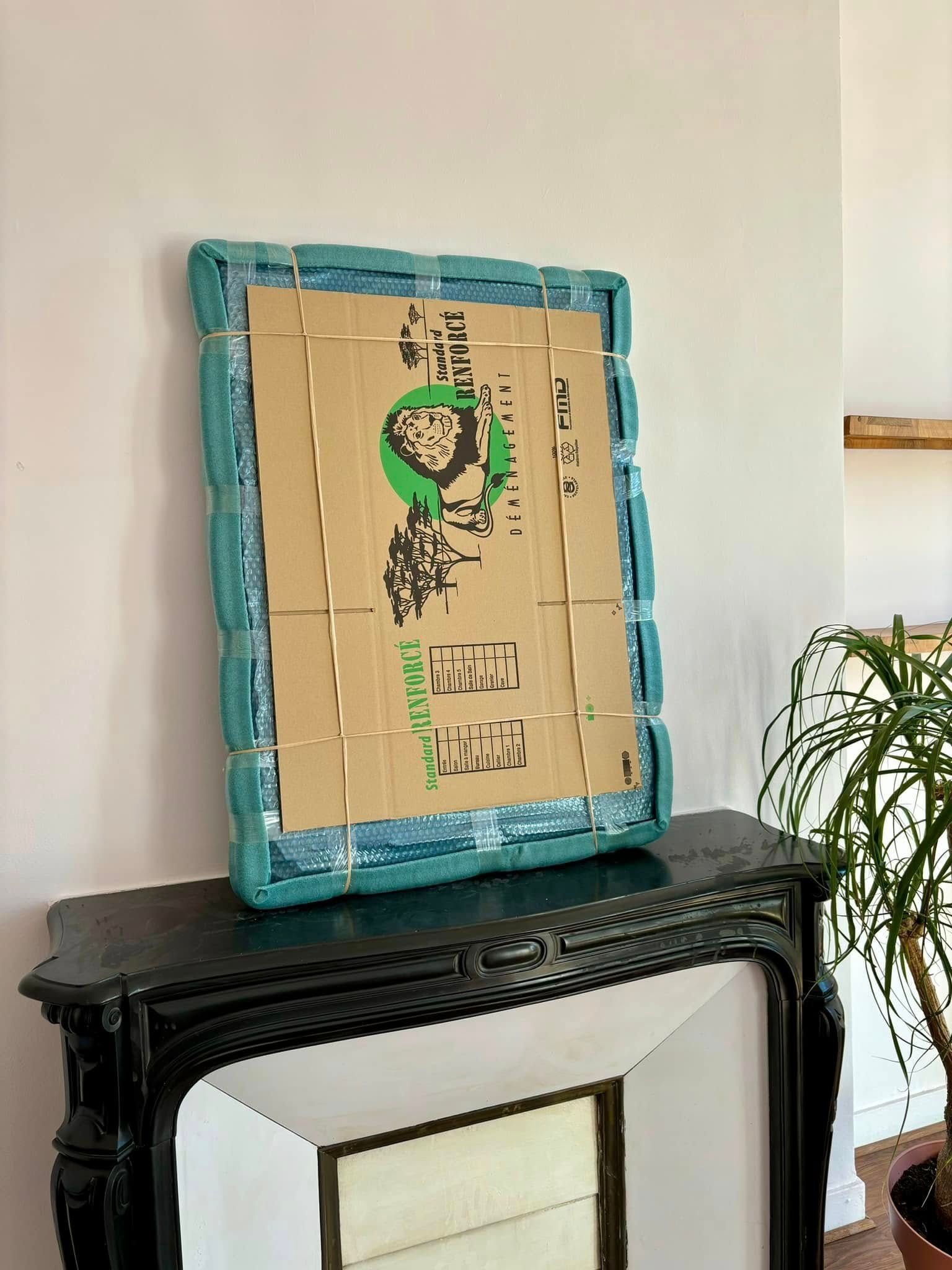 Cadre emballé dans un carton.