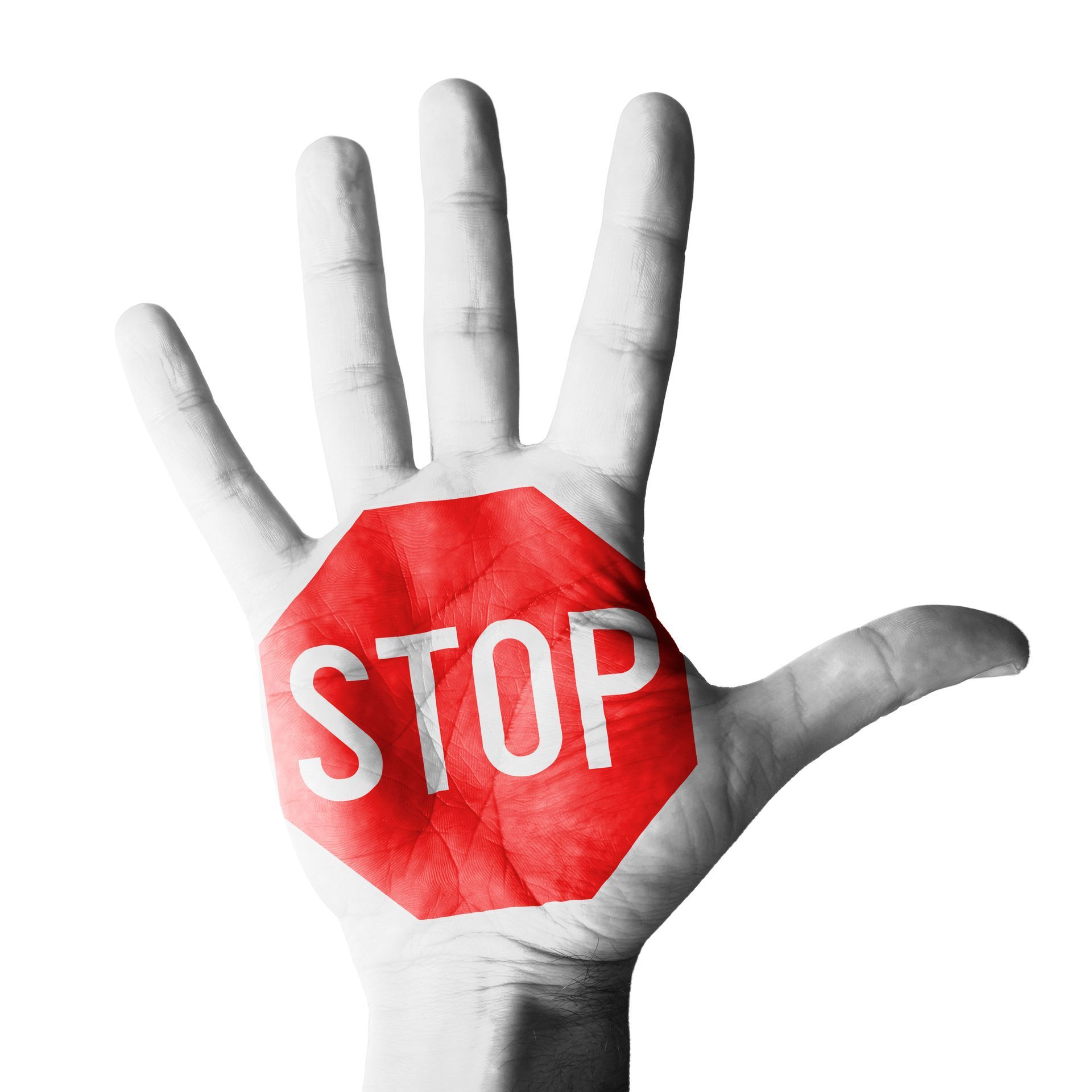 Panneau stop inscrit dans une main ouverte, qui mime l'action de stopper une agression ou un assaillant