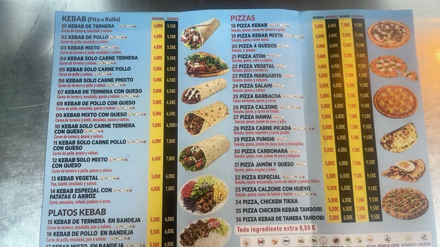 Menú borroso de un restaurante español con platos y precios en columnas, que incluye fotos de comida y postres.