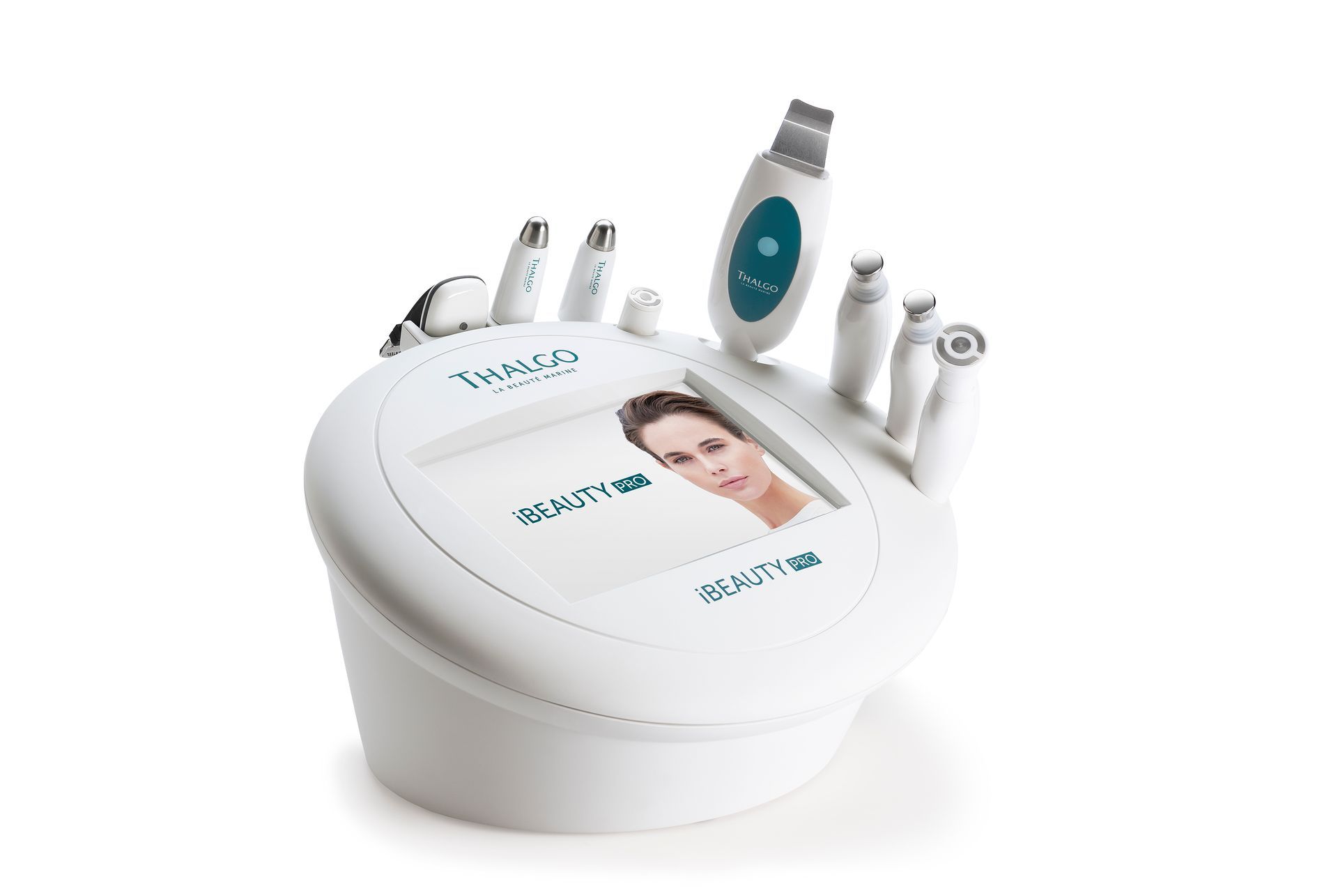 Appareil de soin du visage blanc avec plusieurs embouts et un petit écran.