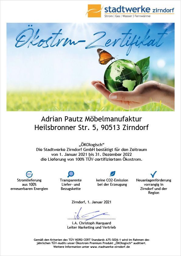 Ökostrom certificate for Adrian Pautz Möbelmanufaktur, Zirndorf. Hand holding globe with butterfly, text.