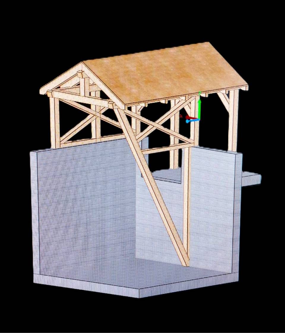 Puits en bois avec toit au-dessus d'un puits en pierre.
