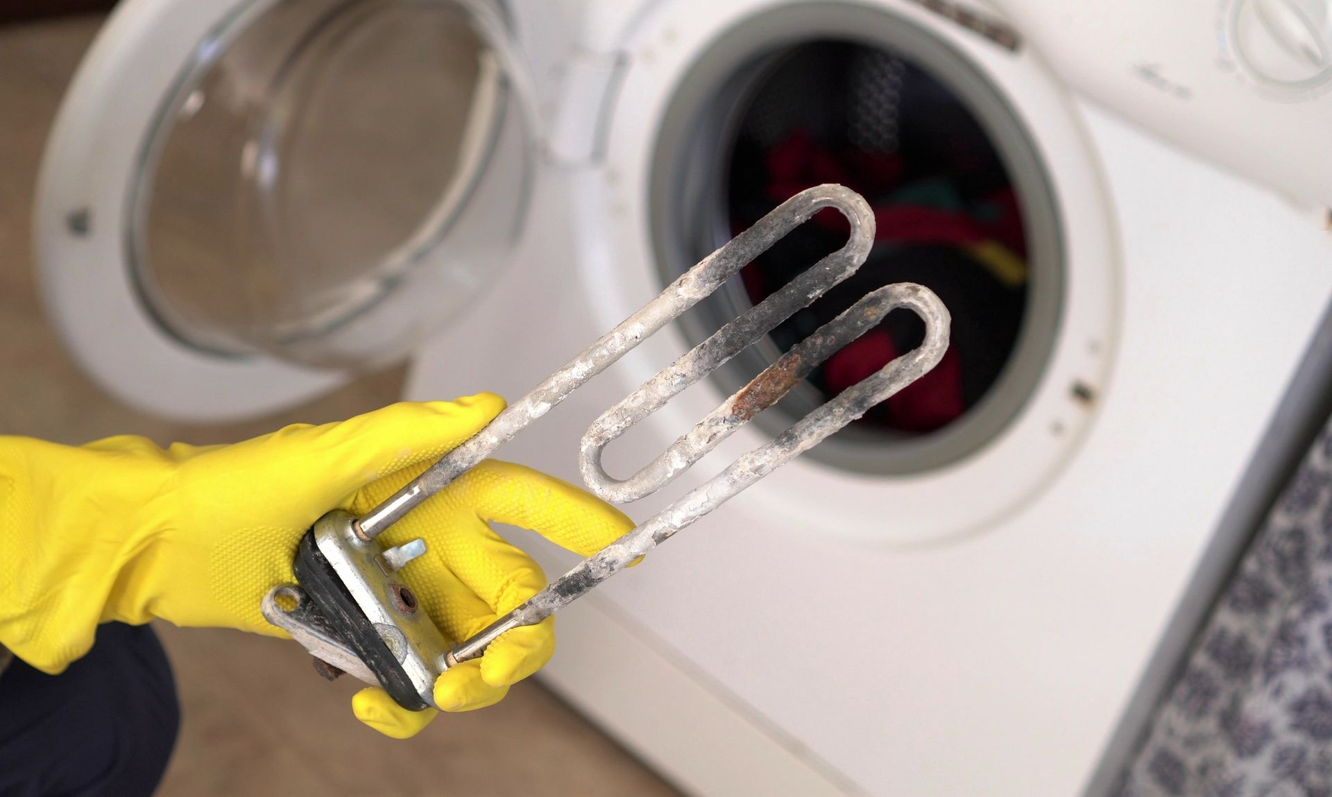 Dépôt de calcaire sur la résistance d'une machine à laver