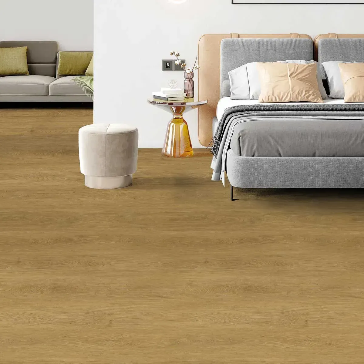 Un dormitorio con cama, sofá, mesa y otomana.