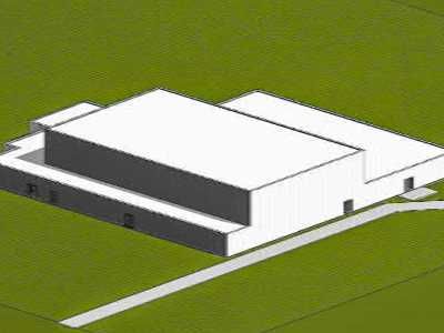 Eine Luftaufnahme eines weißen Gebäudes auf einer grünen Wiese.