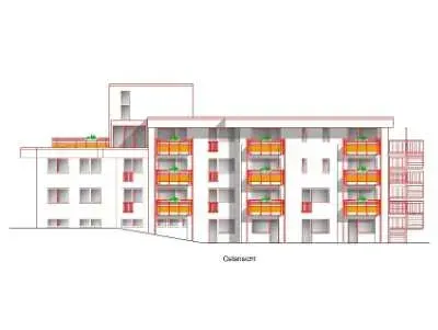 Ein großes Backsteingebäude mit davor geparkten Autos.