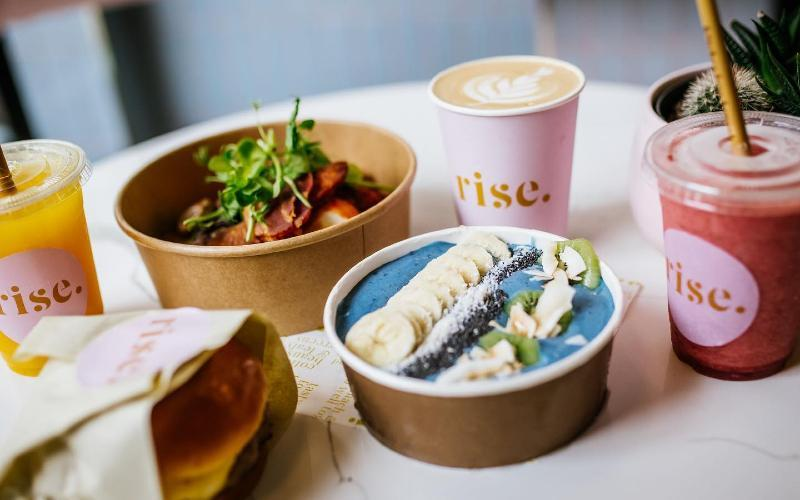 A table topped with bowls of food and drinks.