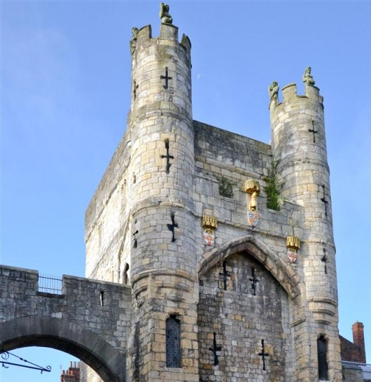 A castle with two towers and crosses on it