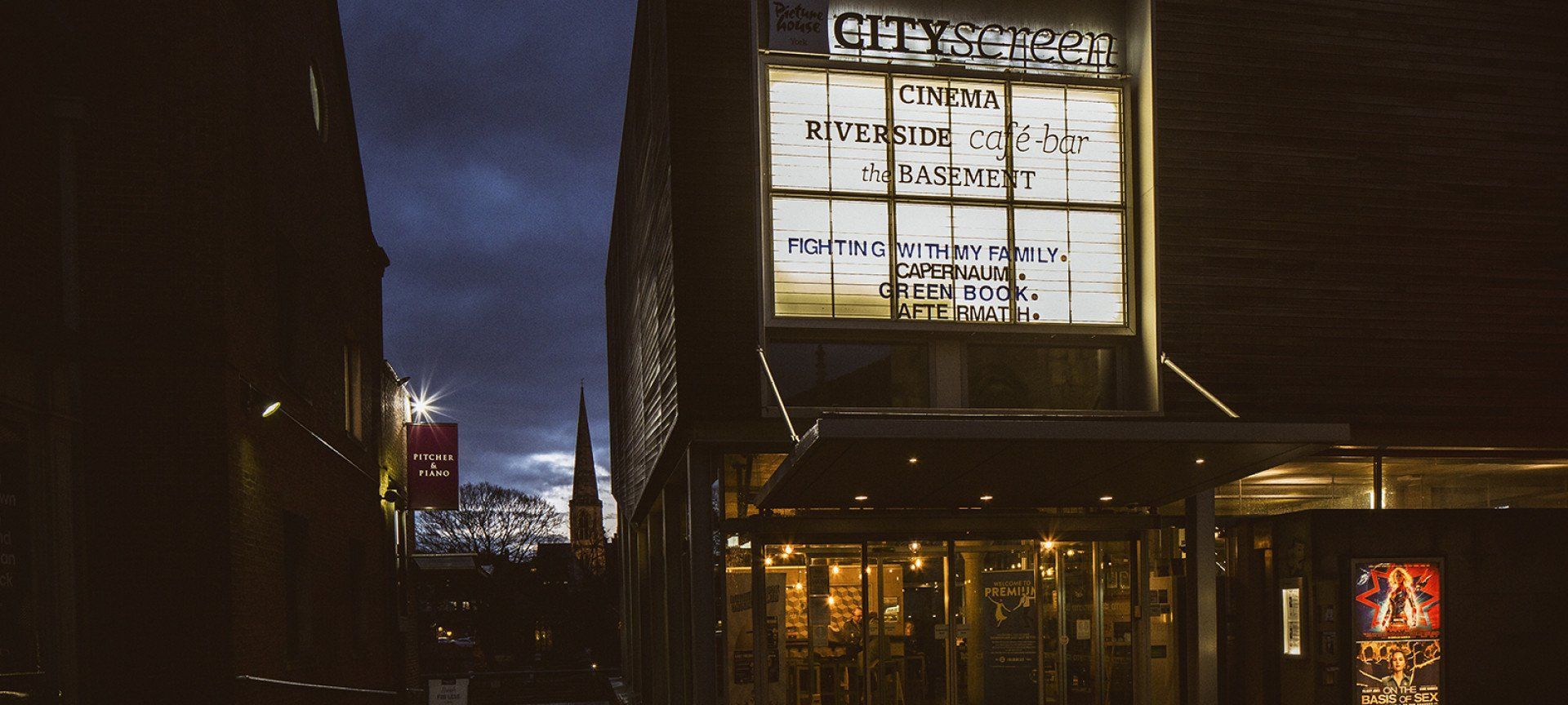 A large building with a large sign on the side of it.