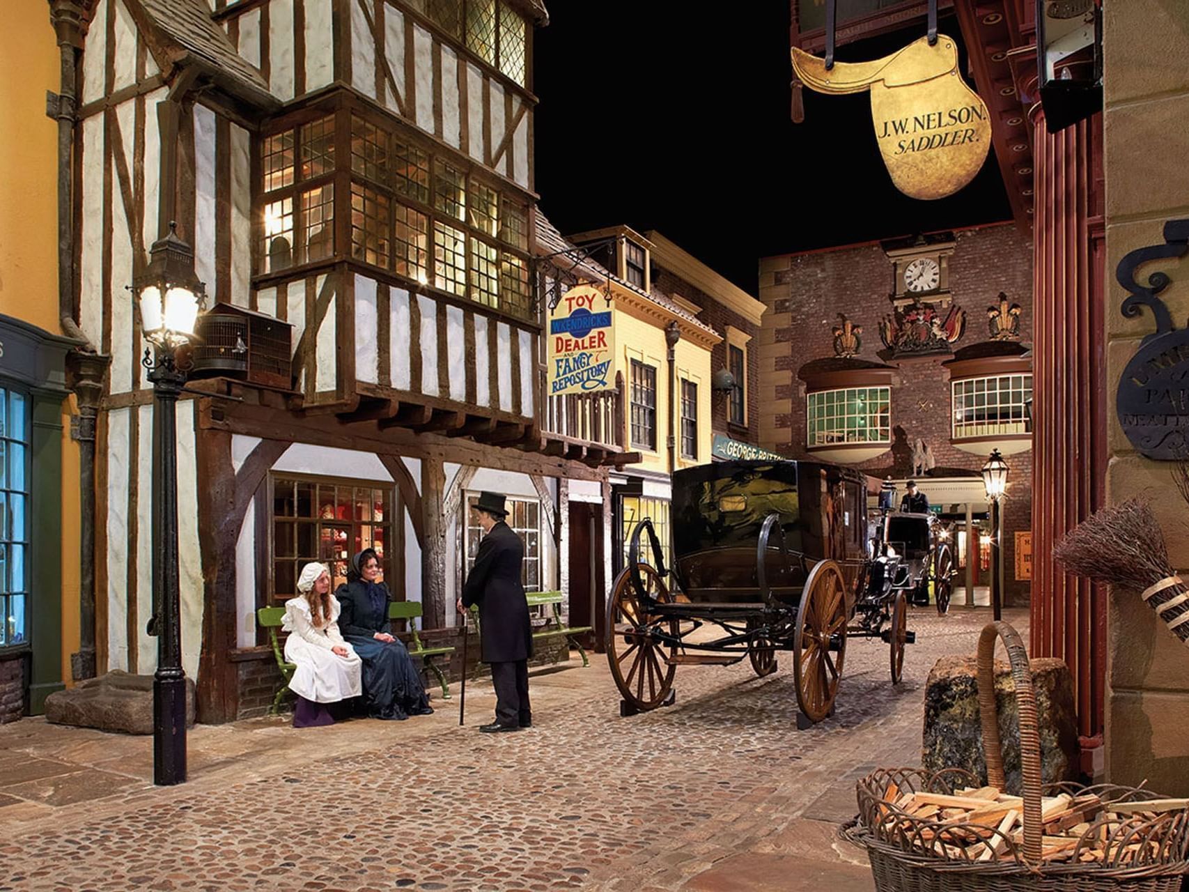 Cobblestone street with old buildings, horse-drawn carriage, people in period clothing, and gas lamps.