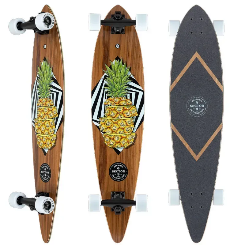 Skateboard cruiser en bois avec motif ananas et trucks noirs.