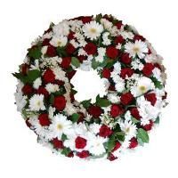 Couronne de fleurs blanche, rouge et verte