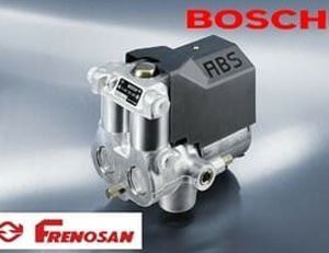 Unidad ABS Bosch fabricada por Frenosan, con cuerpo metálico gris y carcasa electrónica negra.