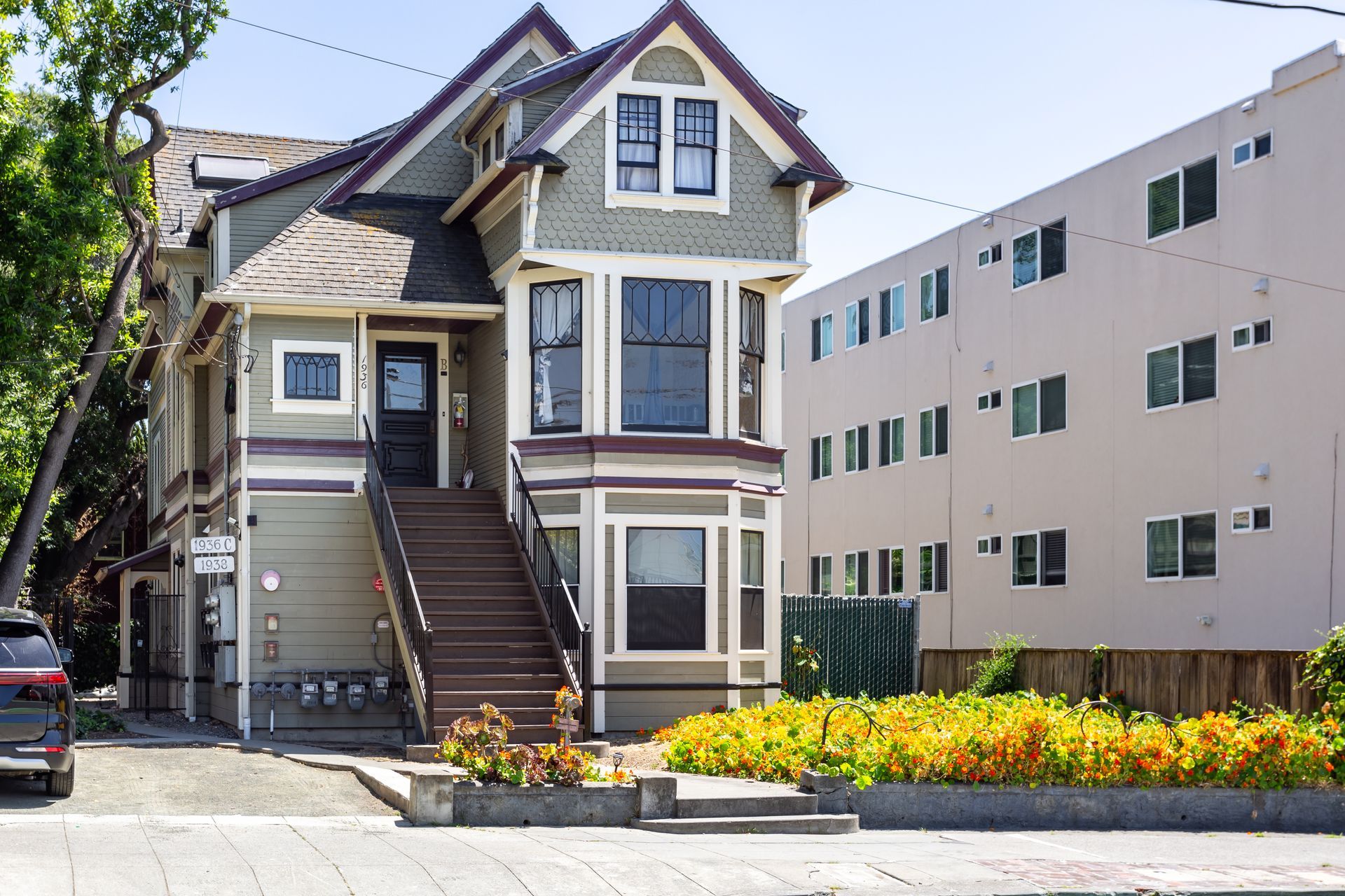 A large house with a car parked in front of it