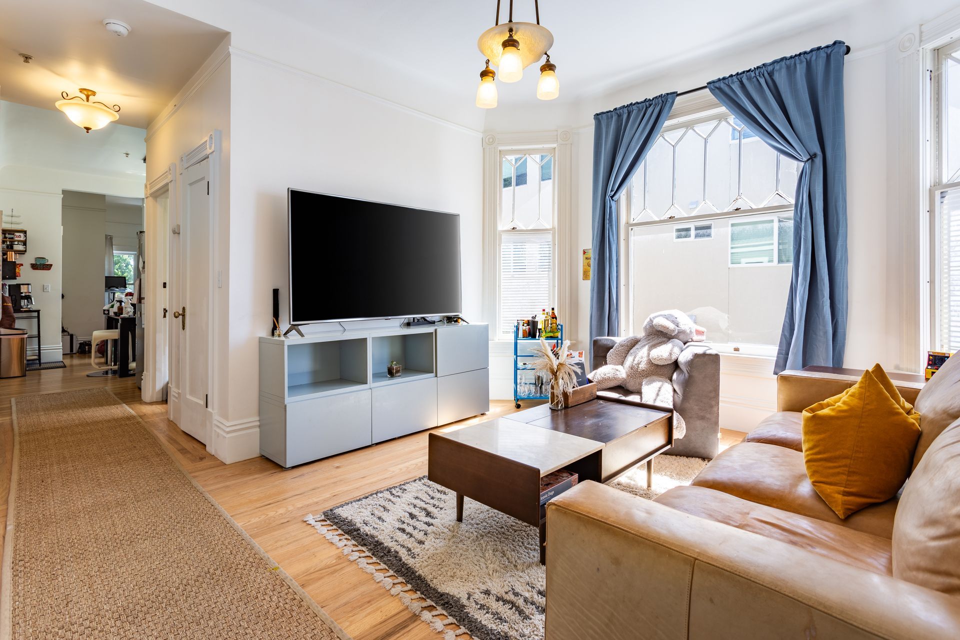A living room with a couch and a flat screen tv