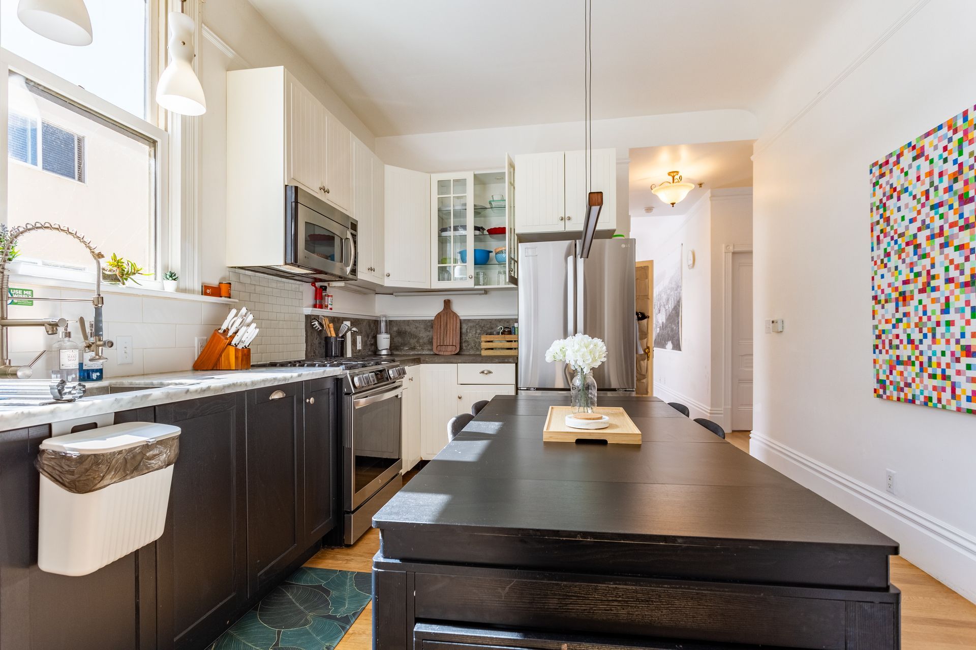 A kitchen with a large island in the middle of it.