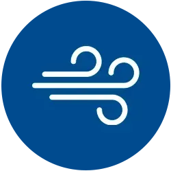 Un círculo azul con un icono blanco de un viento soplando en él.